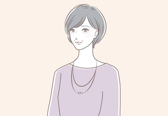 ネックレスを着けて微笑むショートヘアの女性のイラスト